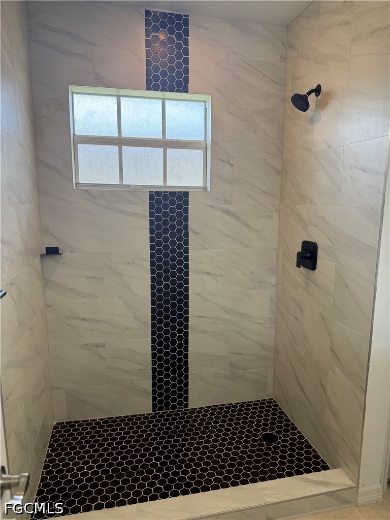 2916 7th Street Southwest Lehigh Acres, FL 33976 - Photo 12 of 19 a bathroom with a shower