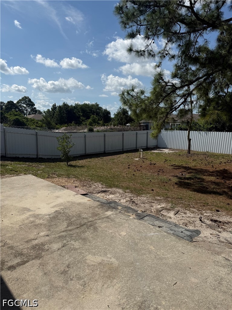 2916 7th Street Southwest Lehigh Acres, FL 33976 - Photo 17 of 19 a view of a backyard