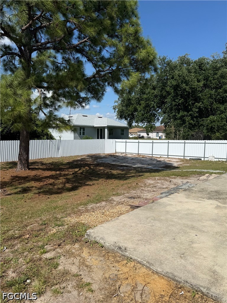 2916 7th Street Southwest Lehigh Acres, FL 33976 - Photo 18 of 19 a view of a swimming pool with an outdoor seating