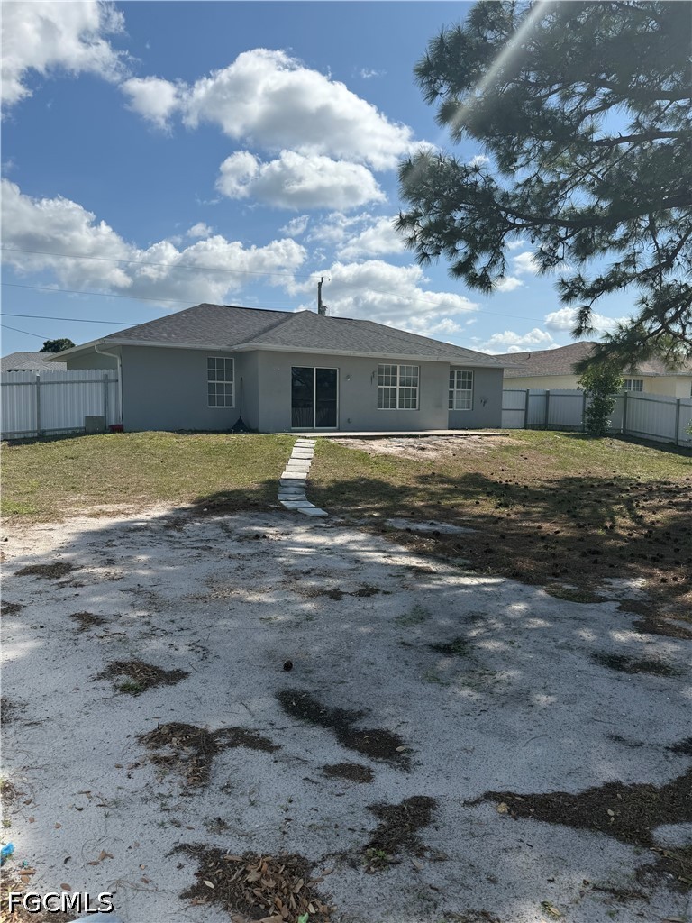 2916 7th Street Southwest Lehigh Acres, FL 33976 - Photo 19 of 19 a view of a yard in front of a house