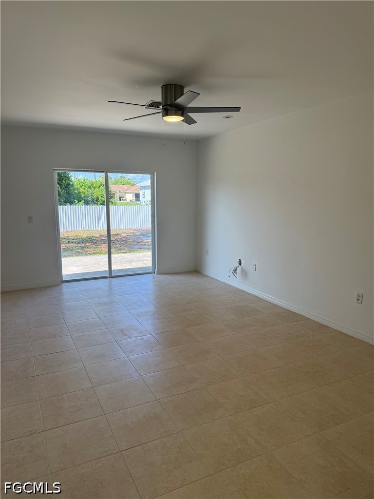 2916 7th Street Southwest Lehigh Acres, FL 33976 - Photo 3 of 19 a view of an empty room with a window