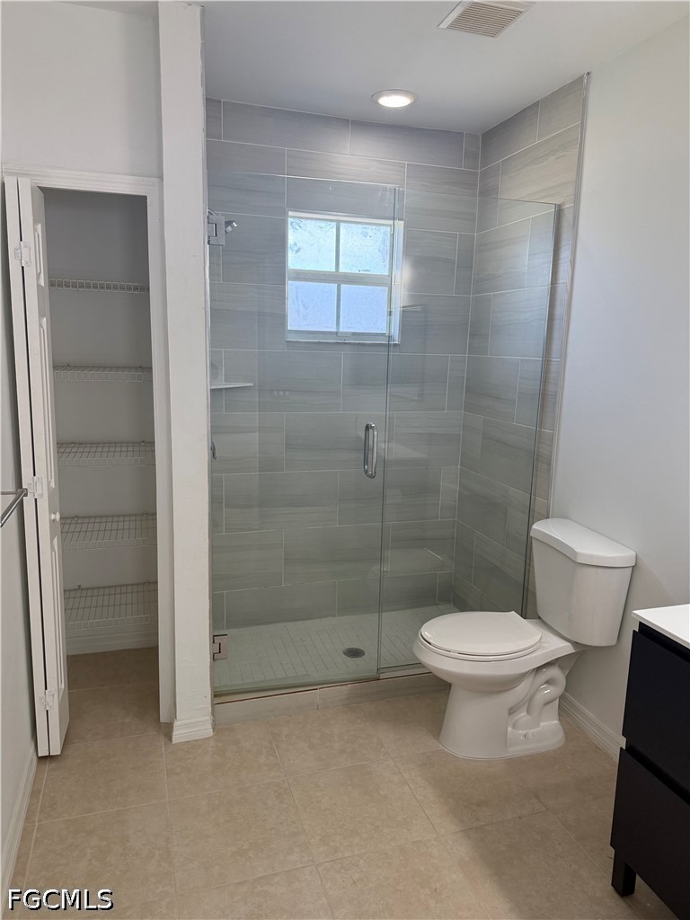 2916 7th Street Southwest Lehigh Acres, FL 33976 - Photo 5 of 19 a bathroom with a toilet and a shower
