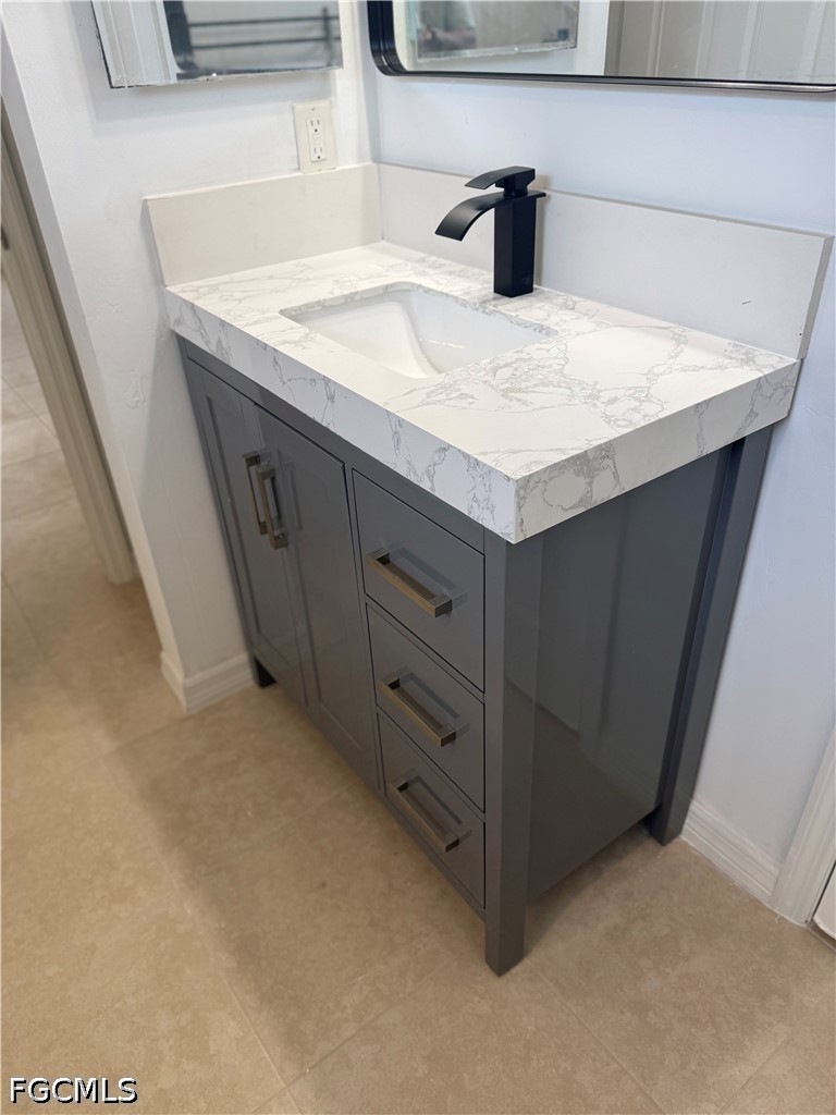 2916 7th Street Southwest Lehigh Acres, FL 33976 - Photo 6 of 19 a kitchen with a sink and a vanity