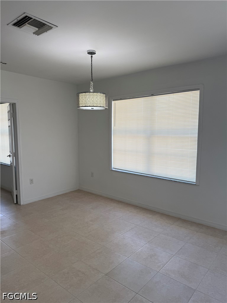 2916 7th Street Southwest Lehigh Acres, FL 33976 - Photo 7 of 19 an empty room with a window