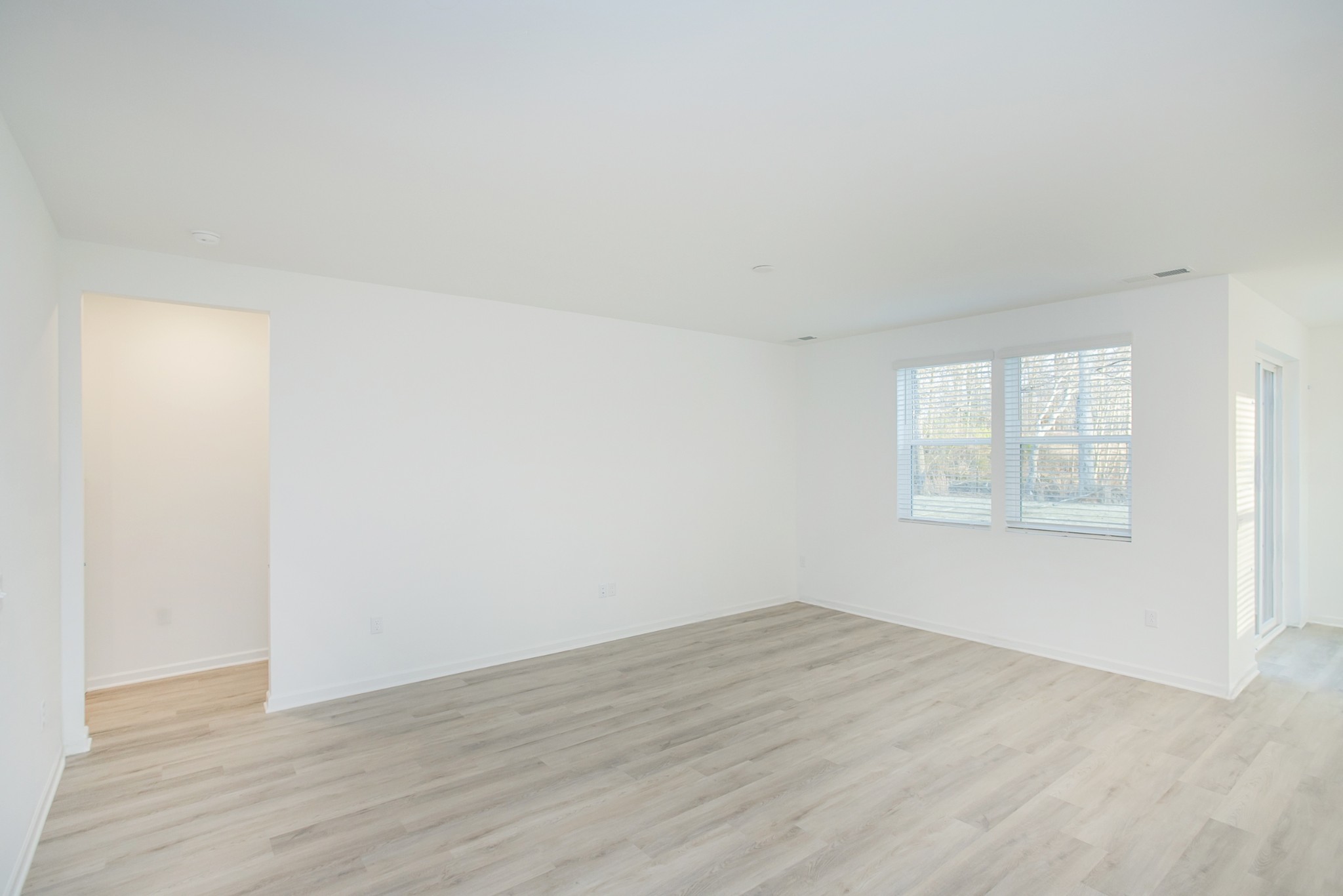 306 Hickory Pointe Drive Dickson, TN 37055 - Photo 19 of 36 an empty room with wooden floor and windows