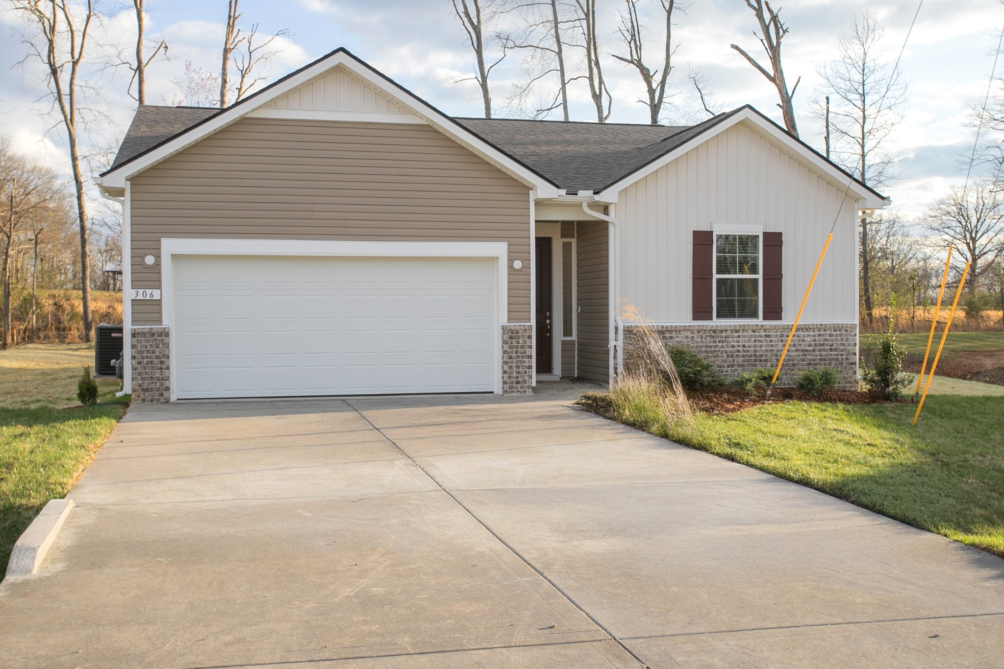 306 Hickory Pointe Drive Dickson, TN 37055 - Photo 2 of 36 a front view of a house with a yard and garage