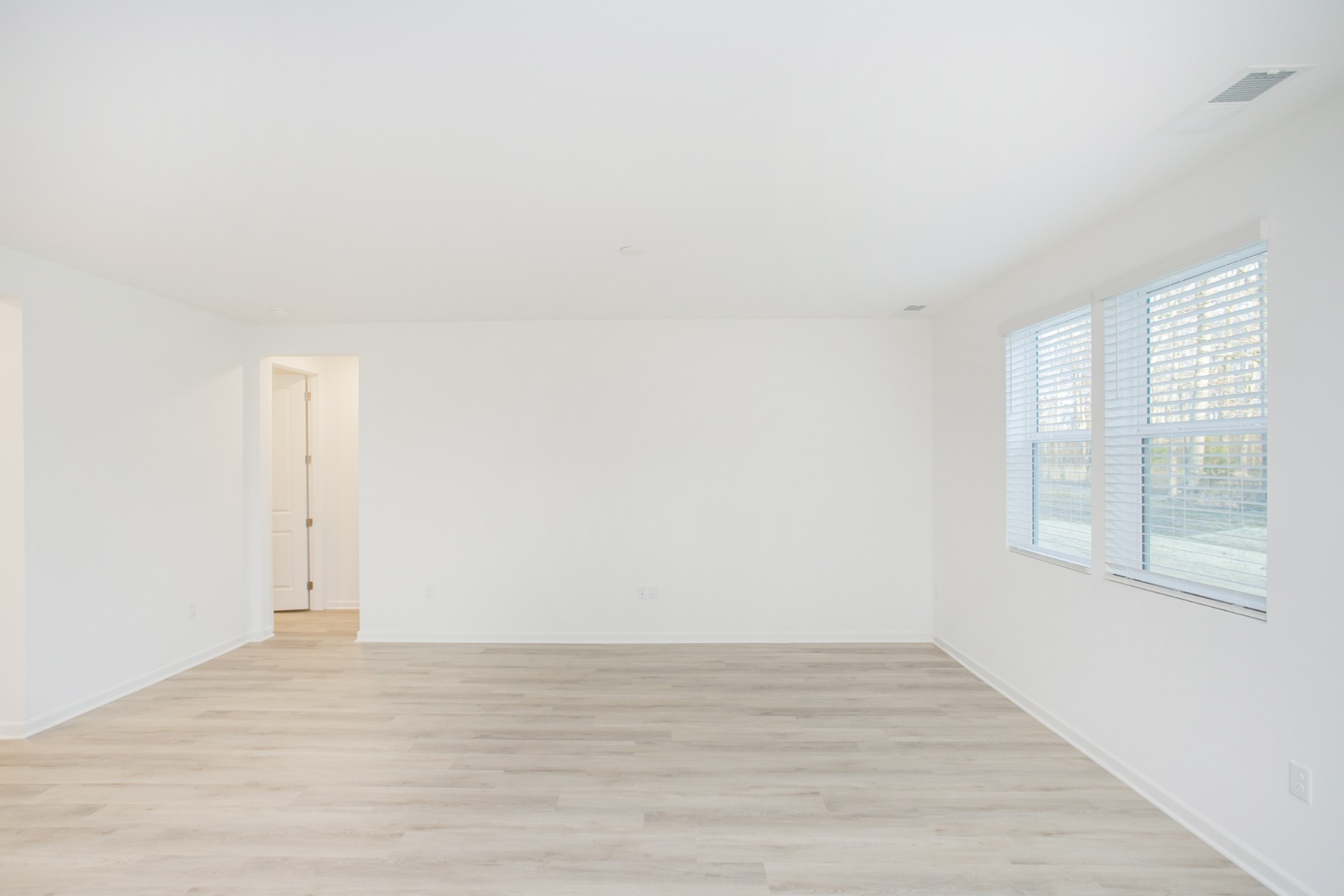 306 Hickory Pointe Drive Dickson, TN 37055 - Photo 21 of 36 a view of an empty room with wooden floor and a window