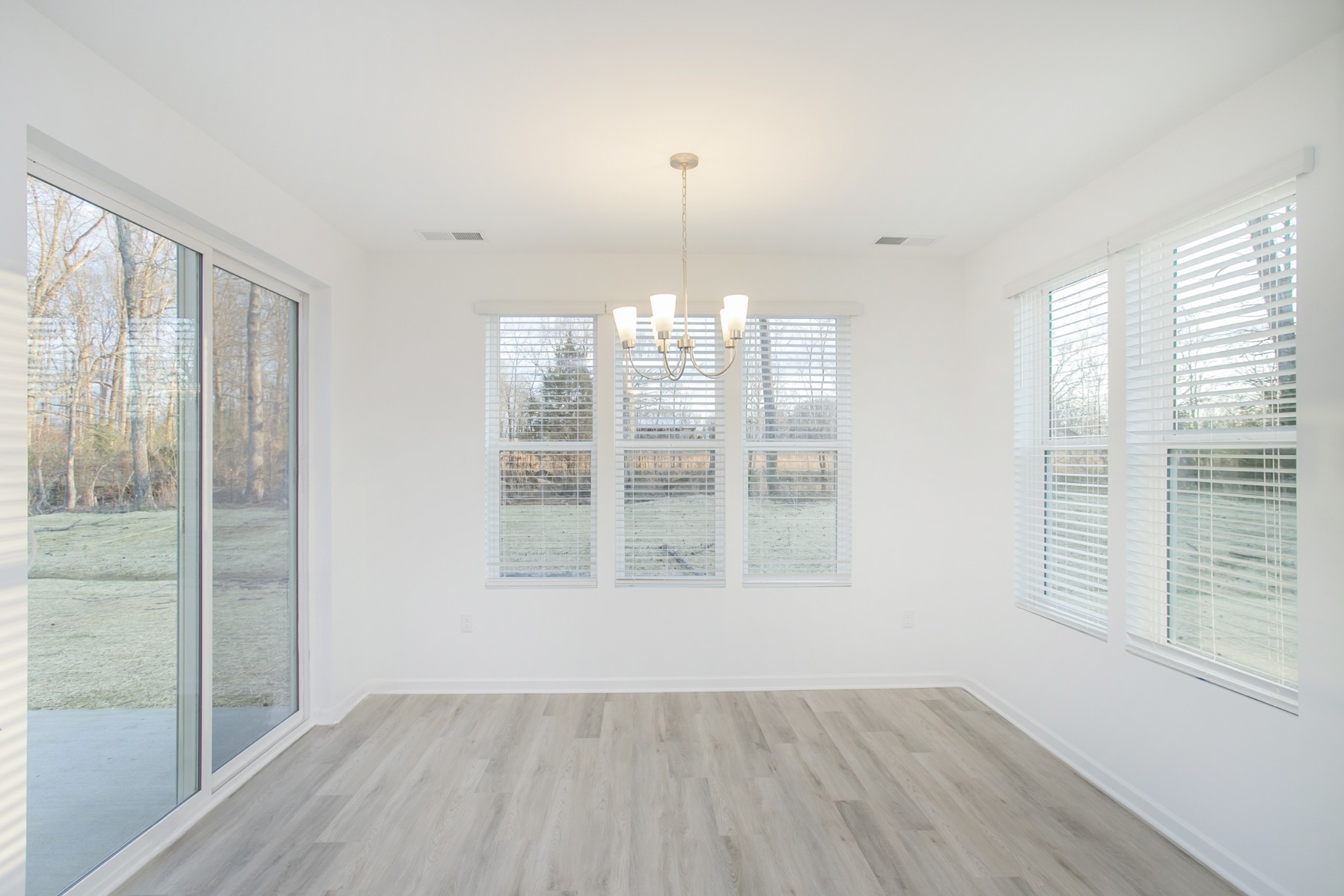 306 Hickory Pointe Drive Dickson, TN 37055 - Photo 23 of 36 a view of an empty room with wooden floor and a window