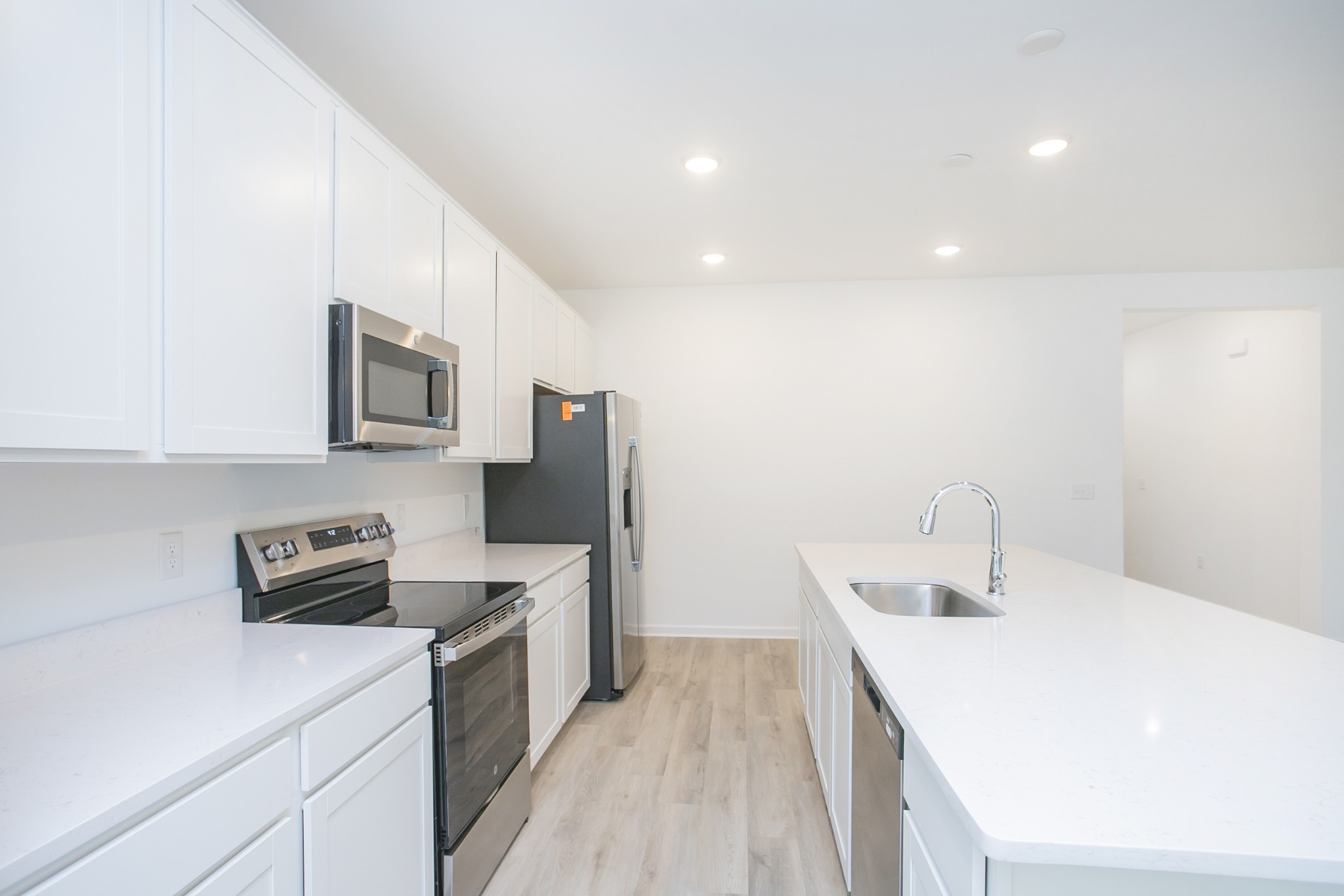 306 Hickory Pointe Drive Dickson, TN 37055 - Photo 24 of 36 a kitchen that has a sink and a stove top oven