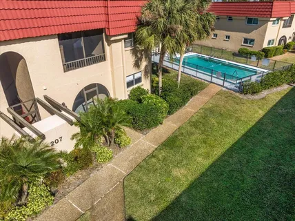a view of backyard with swimming pool