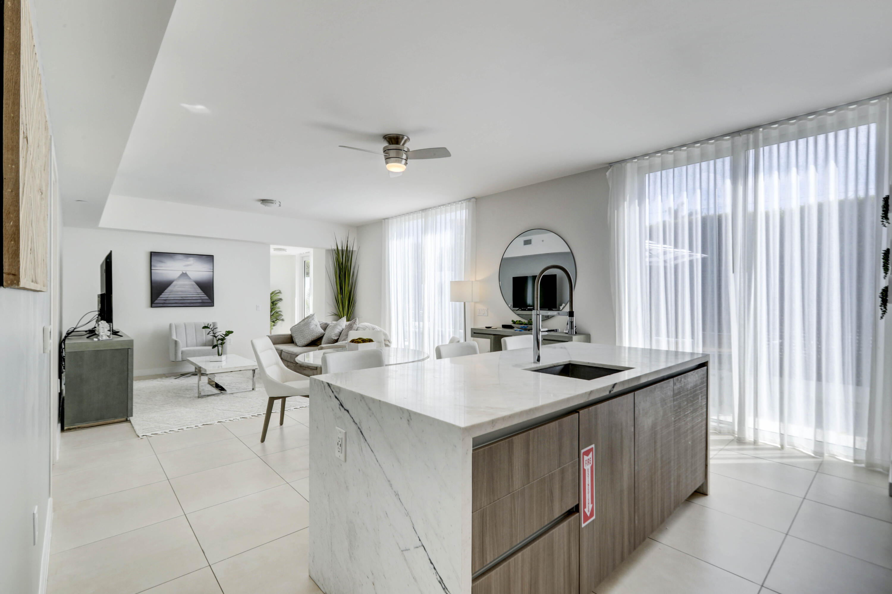 401 North Birch Road, Unit TH3 Fort Lauderdale, FL 33304 - Photo 12 of 49 a view of living room with furniture and fireplace