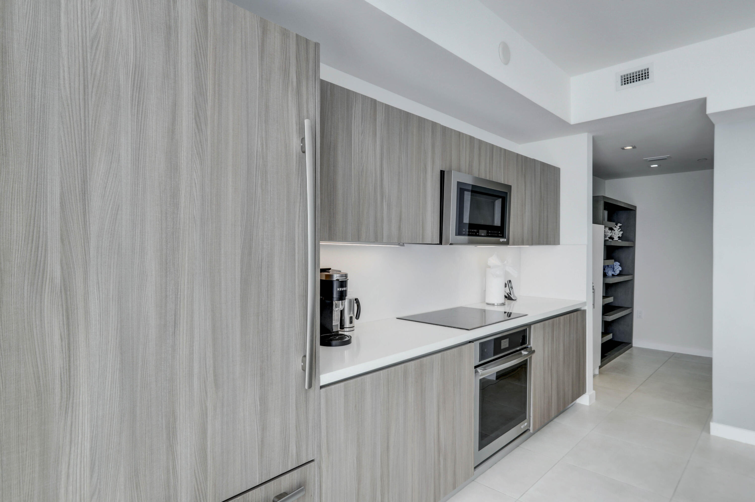 401 North Birch Road, Unit TH3 Fort Lauderdale, FL 33304 - Photo 14 of 49 a kitchen with a sink and a stove top oven