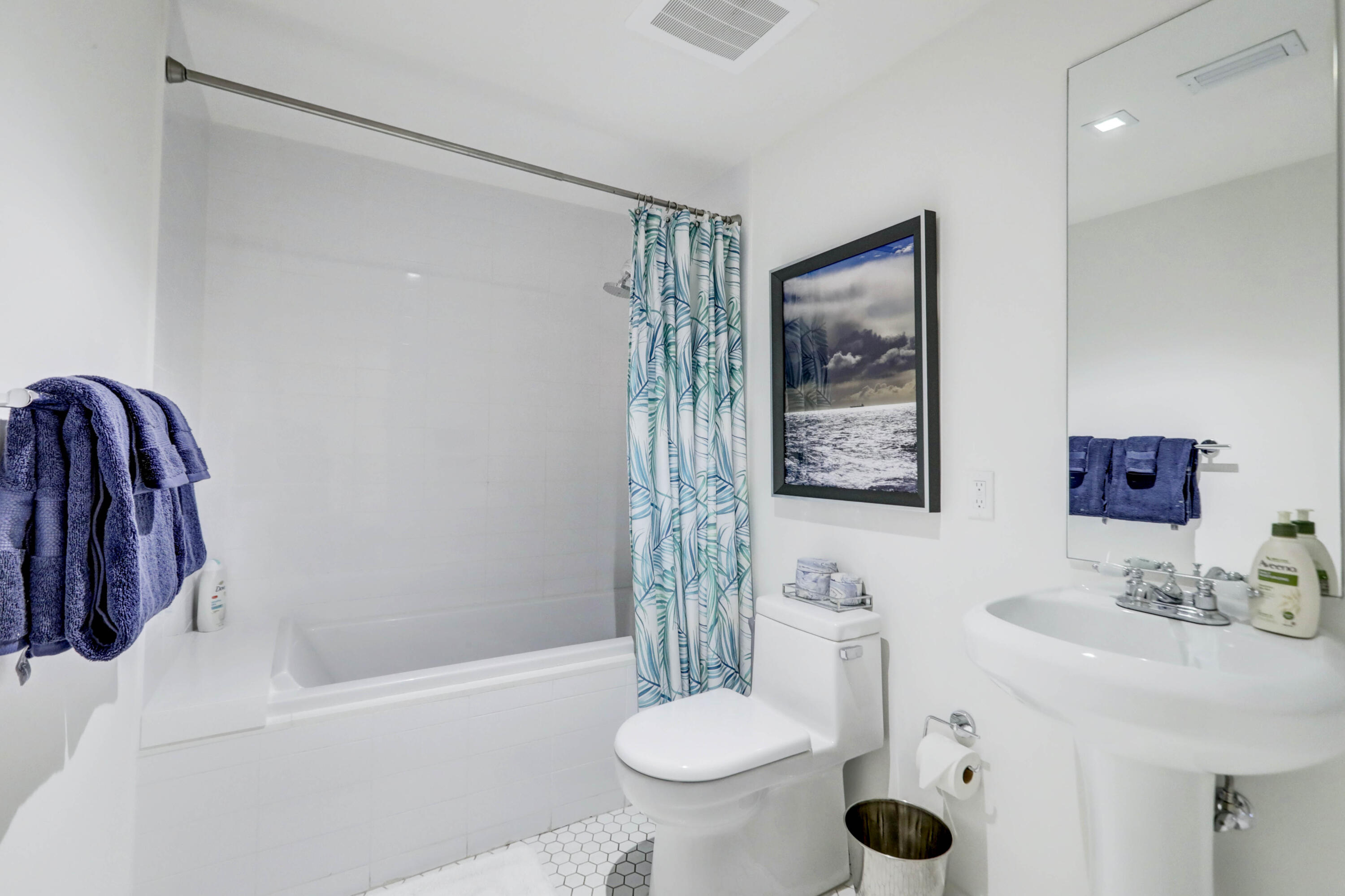 401 North Birch Road, Unit TH3 Fort Lauderdale, FL 33304 - Photo 19 of 49 a bathroom with a sink a toilet a mirror and shower