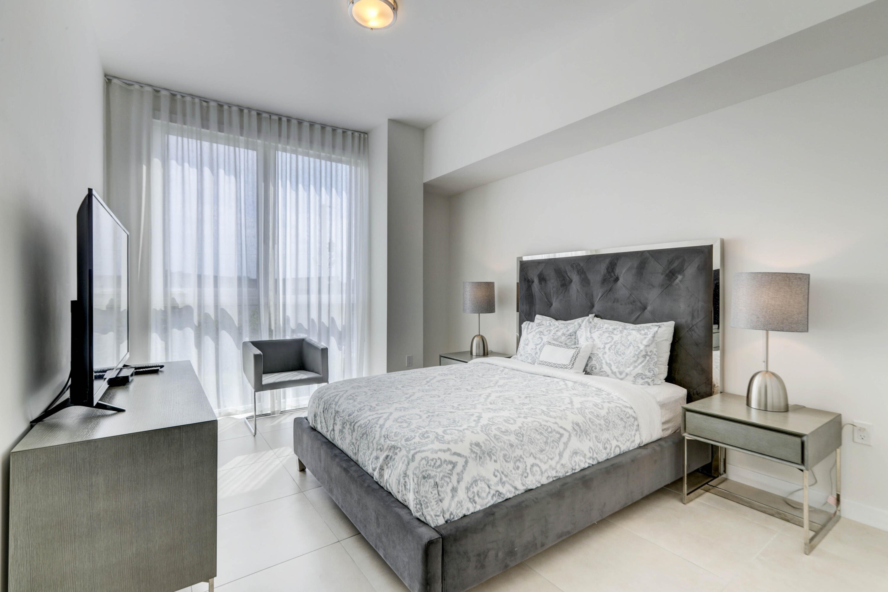 401 North Birch Road, Unit TH3 Fort Lauderdale, FL 33304 - Photo 25 of 49 a bedroom with a bed and a night stand