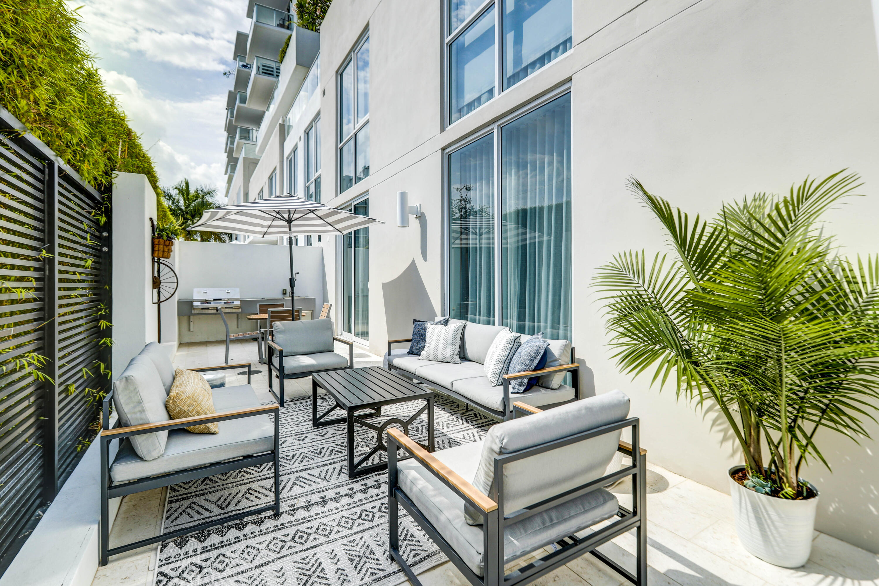 401 North Birch Road, Unit TH3 Fort Lauderdale, FL 33304 - Photo 27 of 49 a view of a roof deck with couches and potted plants