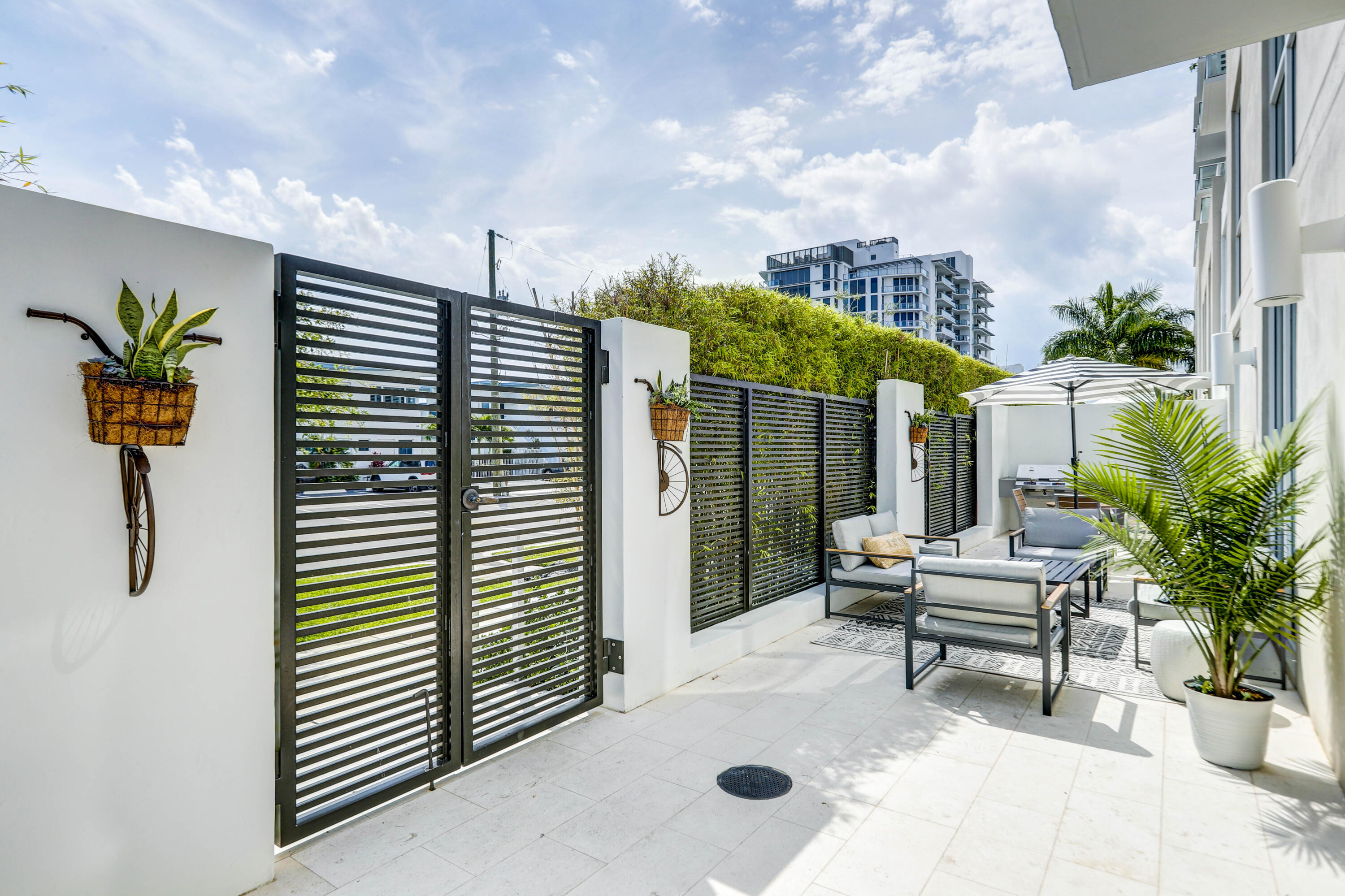 401 North Birch Road, Unit TH3 Fort Lauderdale, FL 33304 - Photo 31 of 49 a balcony with furniture and a potted plant
