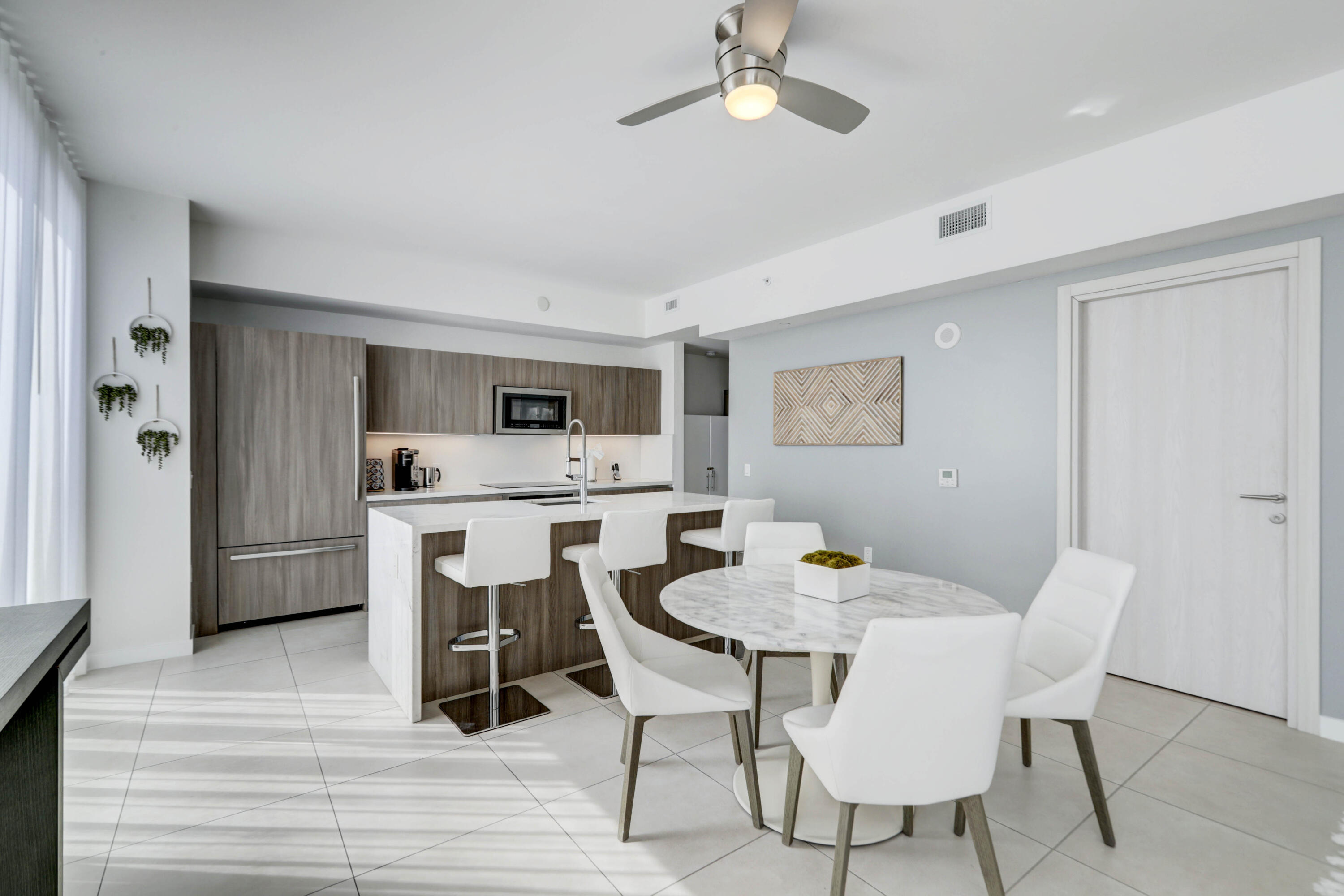 401 North Birch Road, Unit TH3 Fort Lauderdale, FL 33304 - Photo 10 of 49 a dining room with furniture and window