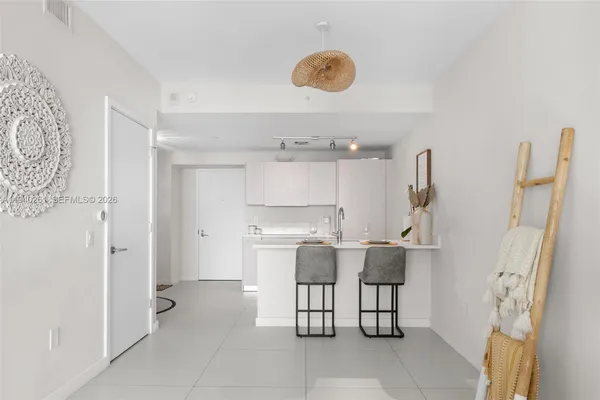 a kitchen with a sink and refrigerator