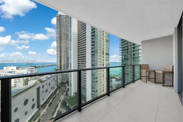 a view of balcony with furniture