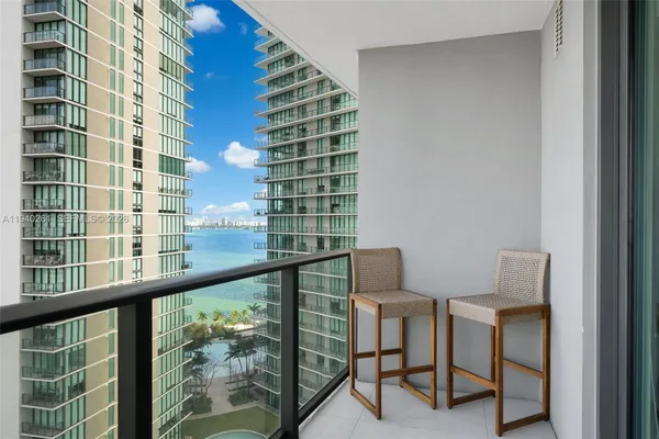 a view of a chair and table in a balcony