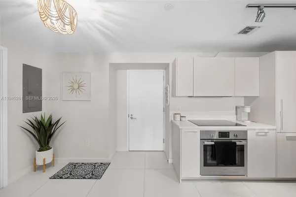 a view of a kitchen with a sink cabinets and a window