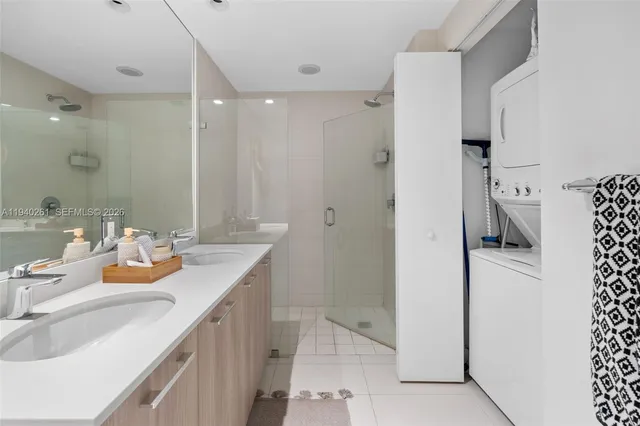 a bathroom with a sink double vanity and a mirror