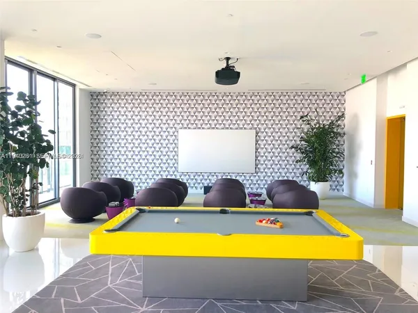 a living room with furniture and window