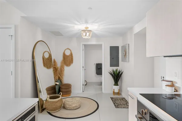 a bathroom with a granite countertop sink a mirror and vanity