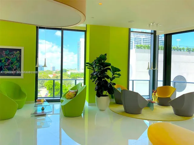 a view of a swimming pool with outdoor seating