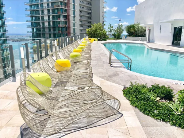 a outdoor dining space with furniture and window
