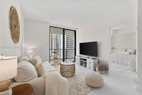 a living room with furniture and a flat screen tv