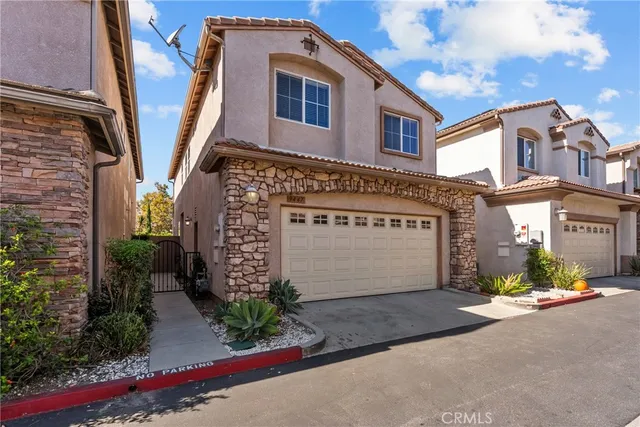 a bathroom with a sink a mirror a toilet and shower