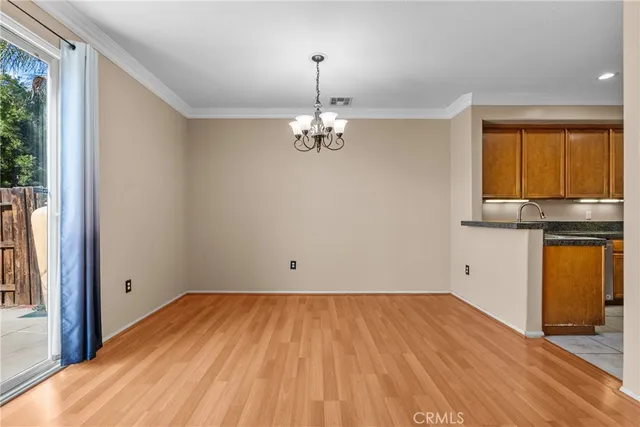a view of a kitchen with a sink stainless steel appliances and cabinets