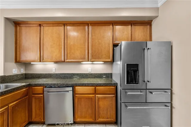 a kitchen with stainless steel appliances granite countertop sink stove and cabinets