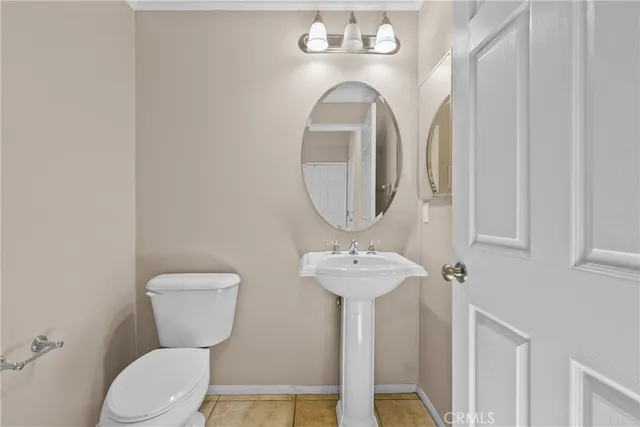 a view of staircase with wooden floor and a potted plant