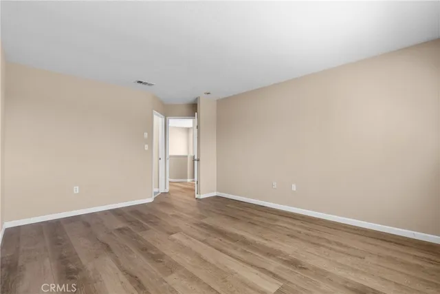 a bathroom with a double vanity sink a large mirror a shower and bathtub