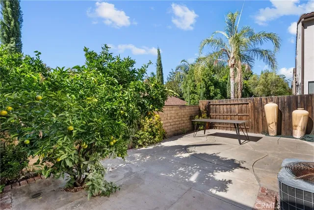a view of a chair and tables in the balcony