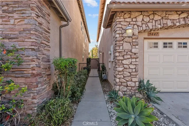 a view of a pathway both side of the house