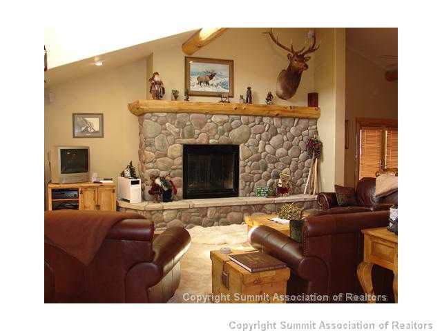 289 Round Hill Road Fairplay, CO 80440 - Photo 3 of 15 a living room with furniture and a fireplace