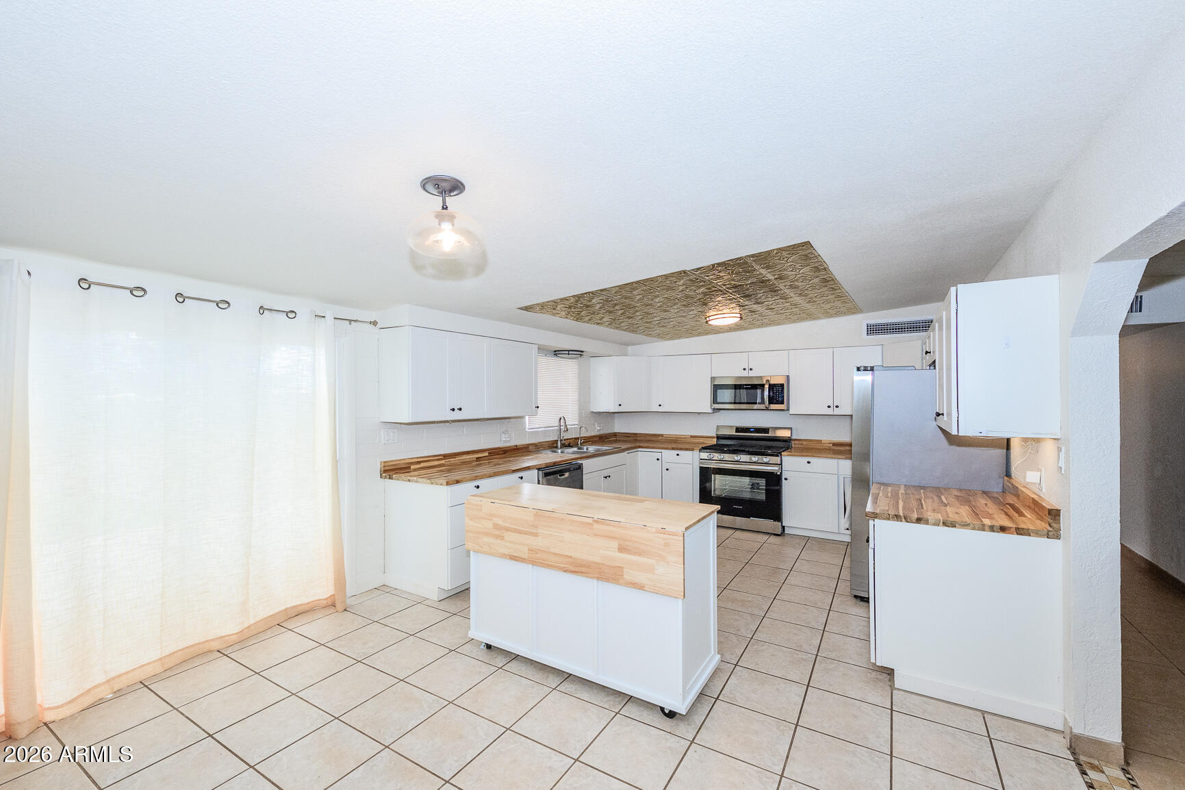 310 2nd Street Huachuca City, AZ 85616 - Photo 12 of 43 a kitchen with granite countertop a sink cabinets and stainless steel appliances
