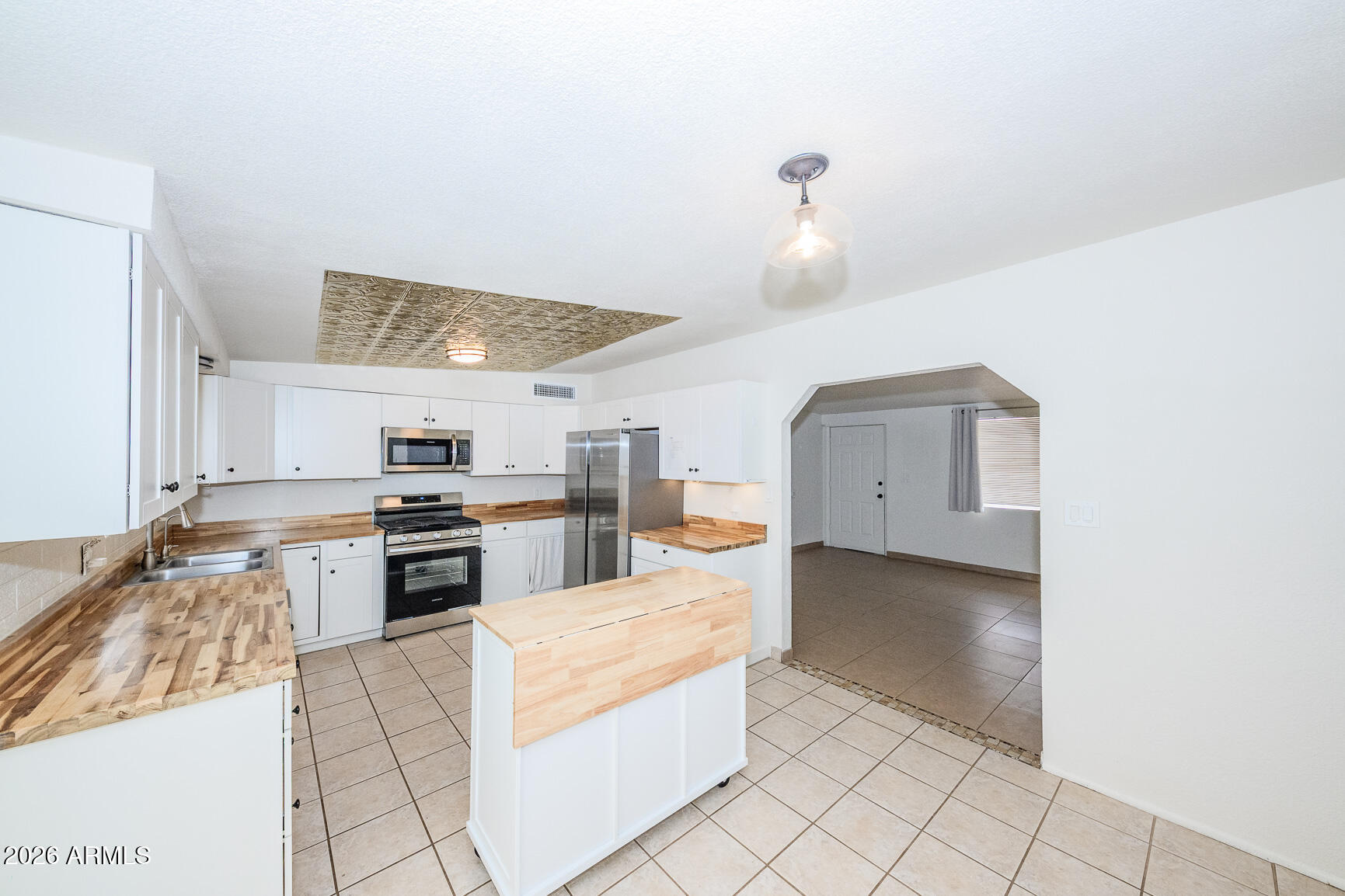 310 2nd Street Huachuca City, AZ 85616 - Photo 13 of 43 a large kitchen with cabinets and stainless steel appliances
