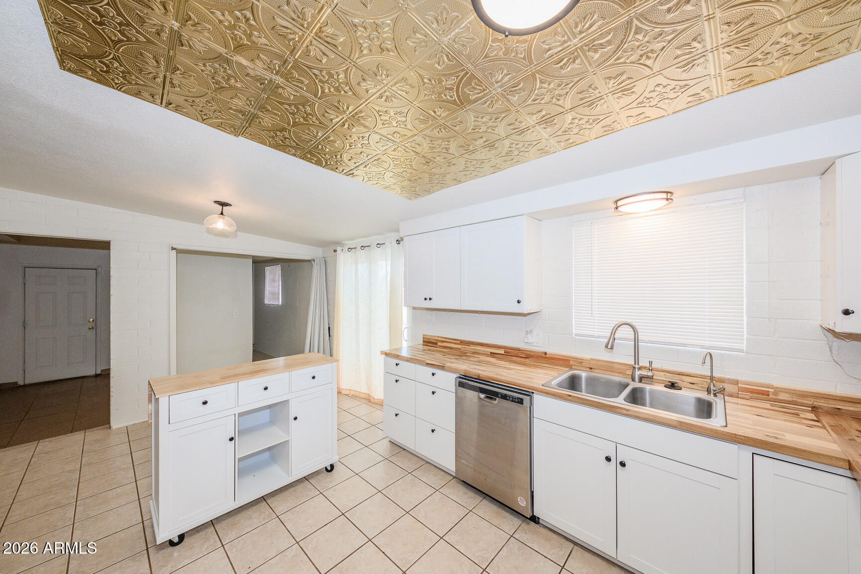 310 2nd Street Huachuca City, AZ 85616 - Photo 18 of 43 a room with white cabinets and sink