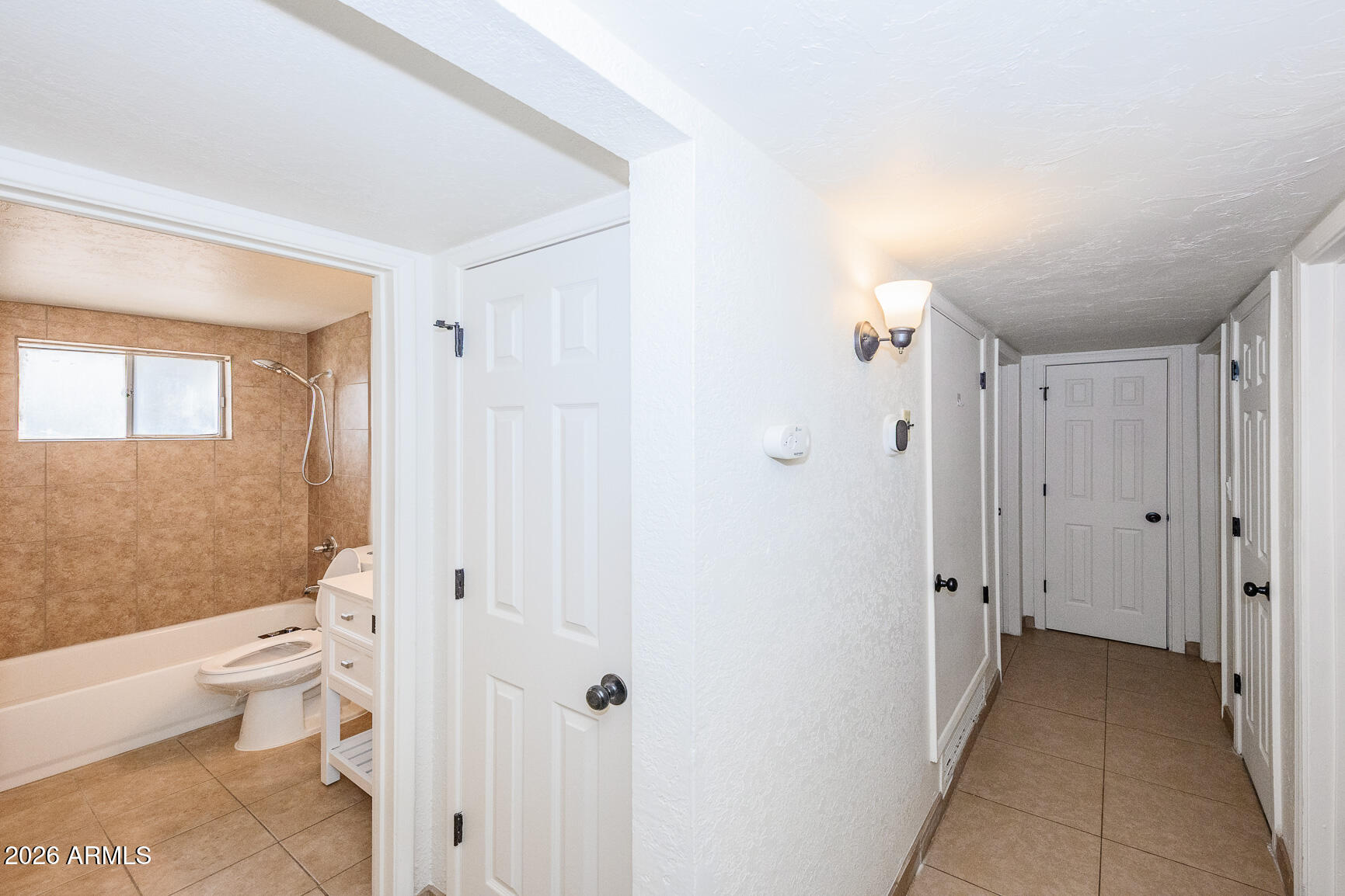 310 2nd Street Huachuca City, AZ 85616 - Photo 21 of 43 a bathroom with a toilet sink and shower