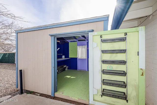 a kitchen with granite countertop a sink cabinets and appliances