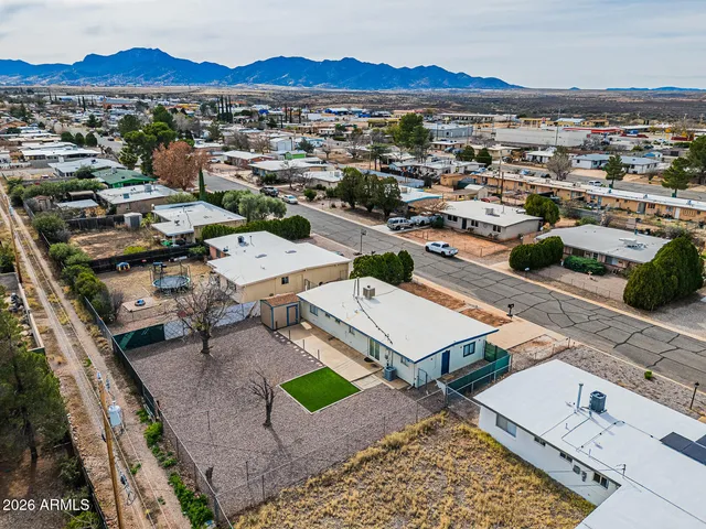 a aerial view of a house with a yard