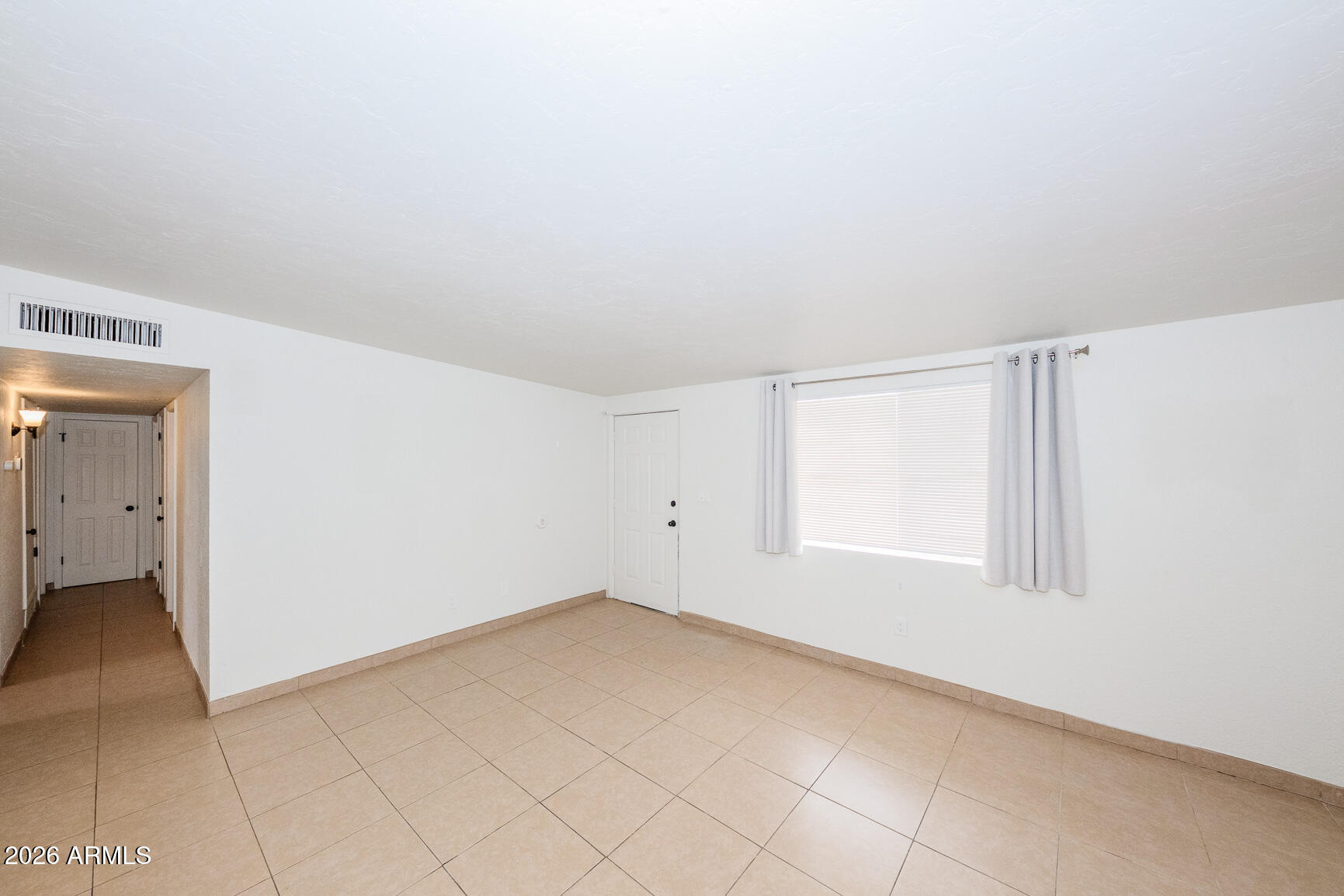 310 2nd Street Huachuca City, AZ 85616 - Photo 5 of 43 an empty room with windows