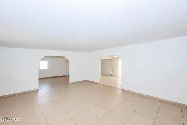 an empty room with a empty space and window