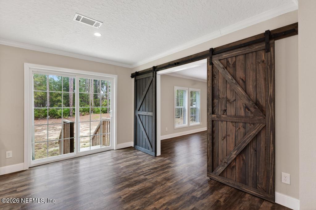 95605 Springhill Road Fernandina Beach, FL 32034 - Photo 22 of 62 a view of entryway with wooden floor and stairs