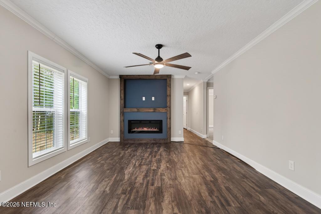 95605 Springhill Road Fernandina Beach, FL 32034 - Photo 25 of 62 a view of an empty room with wooden floor and a window