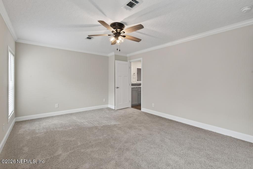 95605 Springhill Road Fernandina Beach, FL 32034 - Photo 32 of 62 a view of an empty room with a fan